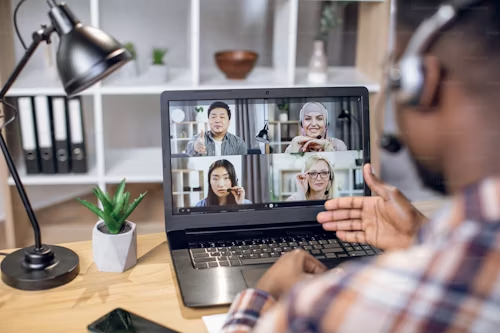 Guy having a meeting with 4 other people