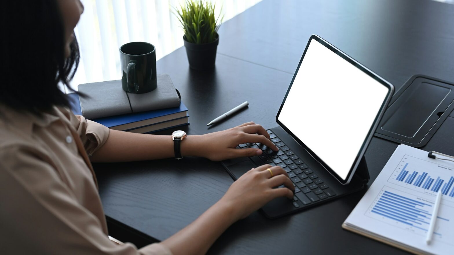 Woman typing on a laptop