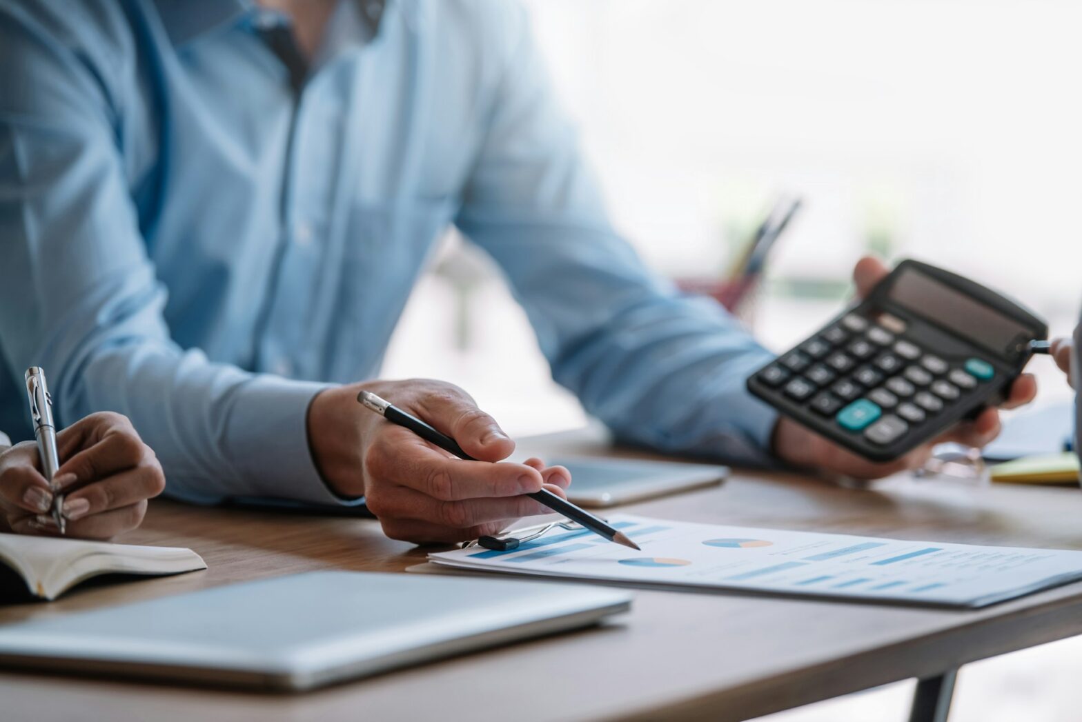 Person holding a calculator