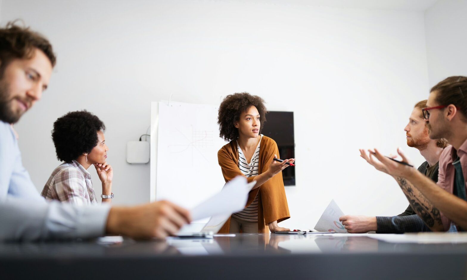 A group of people talking to each other